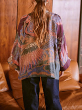Load image into Gallery viewer, Crane Plum kimono jacket with paisley print layered over white lace blouse and dark jeans, boho style - 3
