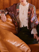 Load image into Gallery viewer, Crane Plum kimono jacket with paisley print layered over white lace blouse and dark jeans, boho style - 4
