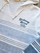Load image into Gallery viewer, Rockaway Beach Stay Salty ombre blue striped baja hoodie with kangaroo pocket and hood on wood floor - 3
