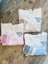 Load image into Gallery viewer, Rockaway Beach Stay Salty ombre blue striped baja hoodie with kangaroo pocket and hood on wood floor - 4

