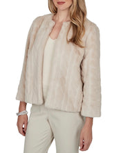 Load image into Gallery viewer, Oatmeal faux fur jacket with collarless neckline, long sleeves, and open front styling on woman - 3
