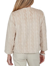 Load image into Gallery viewer, Oatmeal faux fur jacket with collarless neckline, long sleeves, and open front styling on woman - 2
