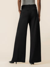 Load image into Gallery viewer, Cheryl super high rise wide leg black trousers with pleated front detail, styled with black heels - 4
