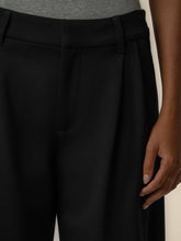 Load image into Gallery viewer, Cheryl super high rise wide leg black trousers with pleated front detail, styled with black heels - 2
