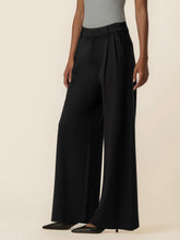 Load image into Gallery viewer, Cheryl super high rise wide leg black trousers with pleated front detail, styled with black heels - 3
