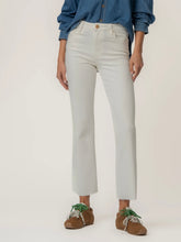 Load image into Gallery viewer, Kelsey high rise ankle flare jeans in ecru paired with blue denim shirt and brown sneakers with green laces - 1
