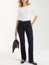 Load image into Gallery viewer, Bobbie Baby Boot Jean in Nocturnal Haze dark wash denim, high-rise flare fit, paired with white ribbed top - 2
