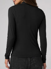 Load image into Gallery viewer, Black twist front high neck long sleeve top styled with dark wash jeans and western belt, fitted silhouette - 2
