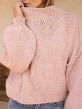 Load image into Gallery viewer, Oversized chunky knit mock neck sweater in light pink paired with wide-leg blue jeans - 2
