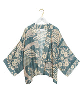 Load image into Gallery viewer, Rosa Blue floral kimono jacket with beige botanical print over blush pink strapless top and maxi skirt - 2
