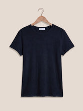 Load image into Gallery viewer, Woman wearing Foundation Slub Tee in Eclipse navy blue, classic crew neck short sleeve cotton t-shirt with jeans - 5
