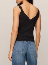 Load image into Gallery viewer, Eve Lace Tank in black with scalloped lace neckline and straps, paired with high-waist wide-leg jeans - 4
