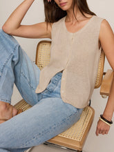 Load image into Gallery viewer, Woman wearing Syd Sweater Vest in Sandstone beige knit with button front, paired with light wash jeans - 5
