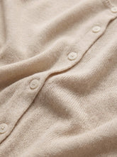 Load image into Gallery viewer, Woman wearing Syd Sweater Vest in Sandstone beige knit with button front, paired with light wash jeans - 6
