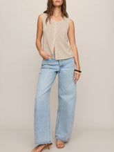 Load image into Gallery viewer, Woman wearing Syd Sweater Vest in Sandstone beige knit with button front, paired with light wash jeans - 3

