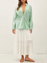 Load image into Gallery viewer, Oversized spearmint green cotton button-down shirt styled open over yellow gingham bikini top with white maxi skirt - 2
