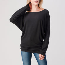 Load image into Gallery viewer, Brushed black dolman top with bateau neckline, long sleeves, and banded hem paired with blue jeans - 1
