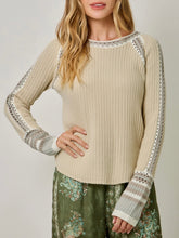Load image into Gallery viewer, Womens almond cream knit sweater with crochet trim detail and striped cuffs paired with floral green pants - 5
