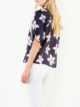 Load image into Gallery viewer, Navy floral puff sleeve top with white and red flower print, V-neck, paired with white pants - 5
