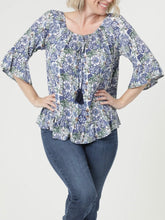 Load image into Gallery viewer, Floral Bell Sleeve Top in Blue Multi with tassel neckline and ruffle hem, paired with blue jeans - 2
