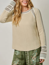 Load image into Gallery viewer, Womens almond cream knit sweater with crochet trim detail and striped cuffs paired with floral green pants - 1
