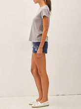 Load image into Gallery viewer, Woman wearing a light gray cotton slub crew neck tee with short sleeves, paired with navy athletic shorts. - 3
