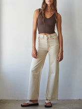 Load image into Gallery viewer, Reversible ribbed crop tank top in coffee brown with V-neck, paired with cream jeans - 2
