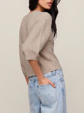 Load image into Gallery viewer, Woman wearing Valor Cardigan in Neutral Heather, cropped cashmere knit with button front and 3/4 sleeves, paired with je - 2
