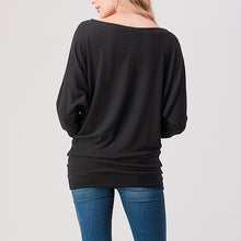 Load image into Gallery viewer, Brushed black dolman top with bateau neckline, long sleeves, and banded hem paired with blue jeans - 4
