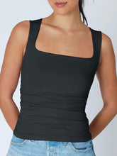 Load image into Gallery viewer, Woman wearing blue square neck shirred tank top with ruched sides paired with light wash denim skirt - 11
