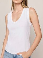 Load image into Gallery viewer, Ellie white v-neck sleeveless tank top styled with light wash wide-leg jeans on female model - 2
