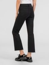 Load image into Gallery viewer, Kelsey high rise ankle flare jeans in black with raw hem, styled with patent leather lace-up oxford shoes - 3
