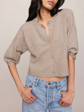 Load image into Gallery viewer, Woman wearing Valor Cardigan in Neutral Heather, cropped cashmere knit with button front and 3/4 sleeves, paired with je - 4
