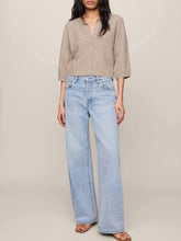 Load image into Gallery viewer, Woman wearing Valor Cardigan in Neutral Heather, cropped cashmere knit with button front and 3/4 sleeves, paired with je - 3
