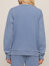 Load image into Gallery viewer, Dazed End Knit Denim Cardigan in Santorini Indigo blue with button front, ribbed cuffs, worn open over white tank top - 5
