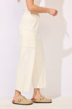 Load image into Gallery viewer, Terry Crop Pant in Pearl ivory with elastic waist, wide leg fit, patch pockets, paired with tan clogs - 2
