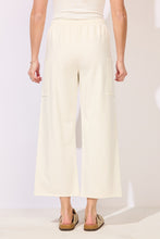 Load image into Gallery viewer, Terry Crop Pant in Pearl ivory with elastic waist, wide leg fit, patch pockets, paired with tan clogs - 3

