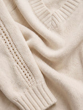Load image into Gallery viewer, Stratton V-neck cream knit sweater with raglan detail and ribbed hem paired with light wash jeans - 5
